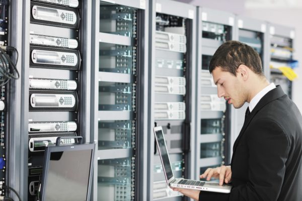 A man working on data centers for cloud services management in local government