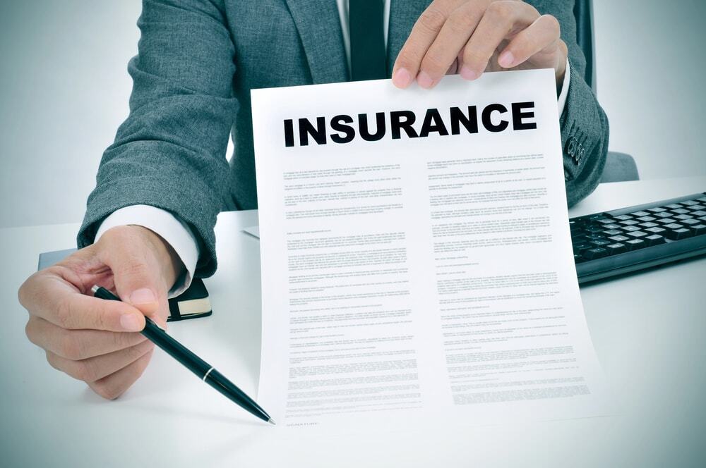 A close-up image of an insurance agent explaining the full coverage for the company.