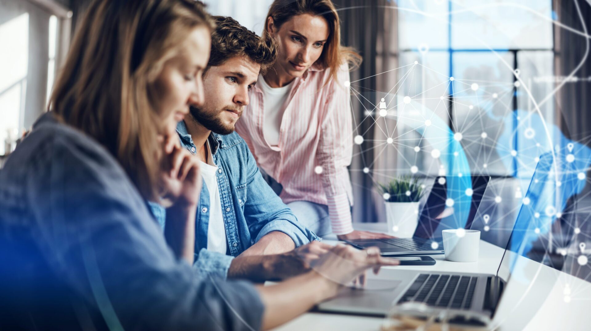 Group of young business people working together on a project. Ne AdobeStock 387763828 scaled